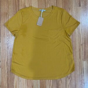 Green Envelope Mustard Top. See Second Photo For Stain. Never Worn. Tag Still On